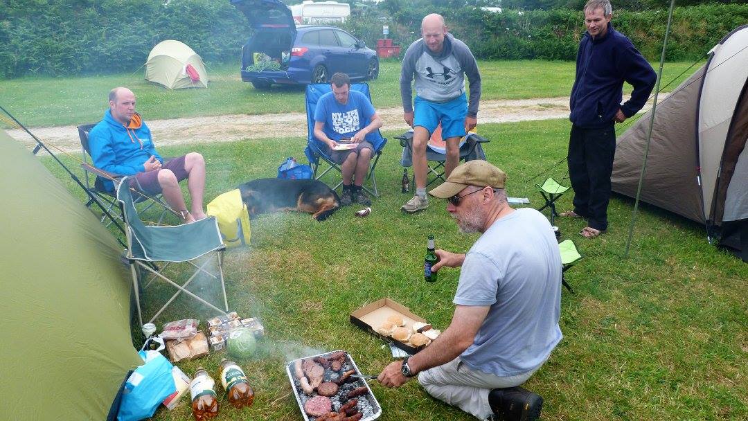 Cooking a campsite meal after a day of climbing in Cornwall.